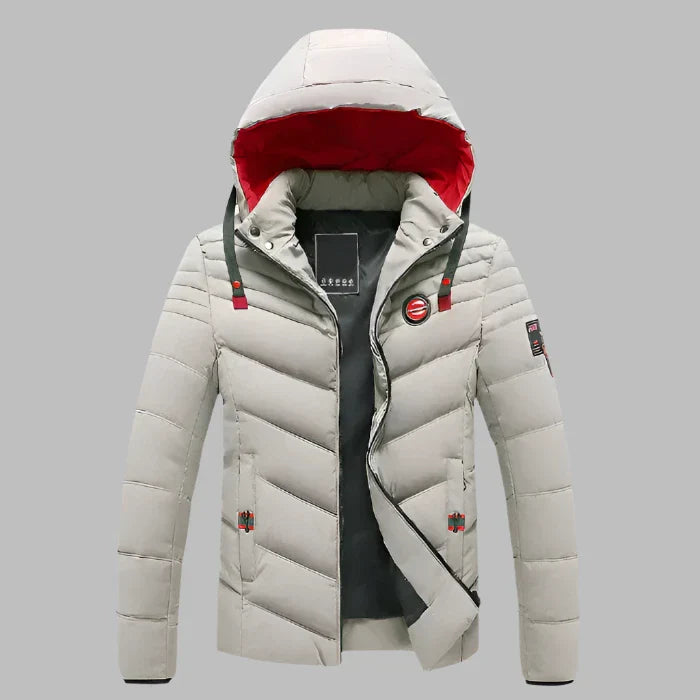 Graue Herren-Daunenjacke mit Kapuze, rotem Innenfutter und Reißverschluss. Winterjacke, warm, stilvoll, ideal für kaltes Wetter.