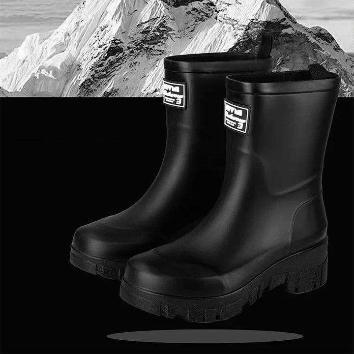 Regenstiefel für den Herbst - Schwarze Chelsea Gummistiefel mit Blockabsatz und Profilsohle für Damen