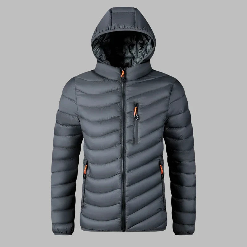 Graue Daunenjacke mit Kapuze, Reißverschlusstaschen und Steppmuster. Ideal für Wintermode, Outdoor-Aktivitäten und kaltes Wetter.