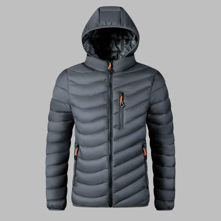 Graue Daunenjacke mit Kapuze, Reißverschlusstaschen und Steppmuster. Ideal für Wintermode, Outdoor-Aktivitäten und kaltes Wetter.
