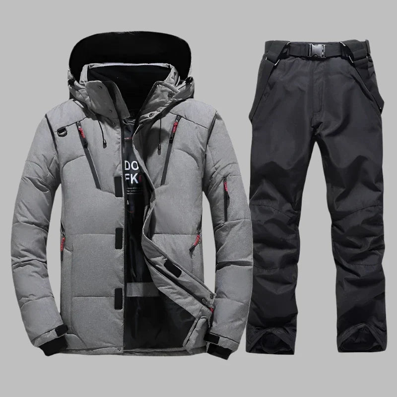 Graue Winterjacke und schwarze Skihose für Herren, wasserdicht und winddicht, ideal für Outdoor-Aktivitäten und Wintersport.