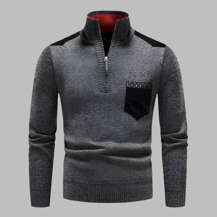 Grauer Herrenpullover mit Reißverschluss, Stehkragen und Brusttasche. Stilvoller Strickpullover für Herbst und Wintermode.
