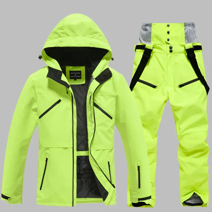 Neongelber Skianzug für Herren, bestehend aus wasserdichter Jacke mit Kapuze und passender Hose mit Hosenträgern, ideal für Wintersport.