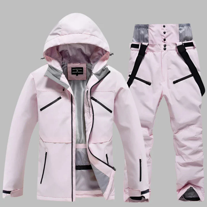 Damen Skianzug rosa, wasserdicht, atmungsaktiv, mit Kapuze und Reißverschlusstaschen. Ideal für Wintersport und Outdoor-Aktivitäten.