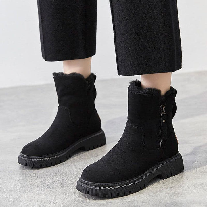 Schwarze Damen-Winterstiefel mit Reißverschluss, warm gefüttert, rutschfeste Sohle, modisch und bequem, ideal für kalte Tage.